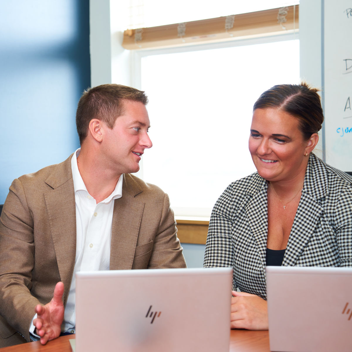 man and woman in a meeting