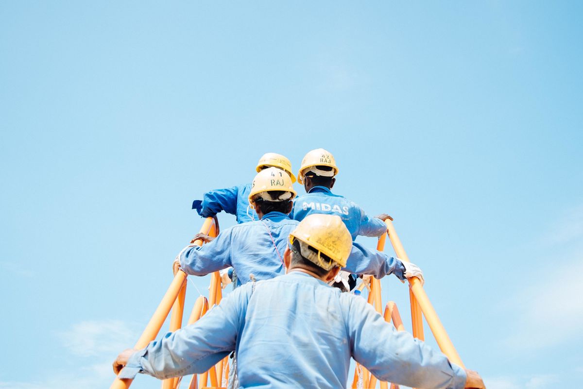 group of people in construction hats