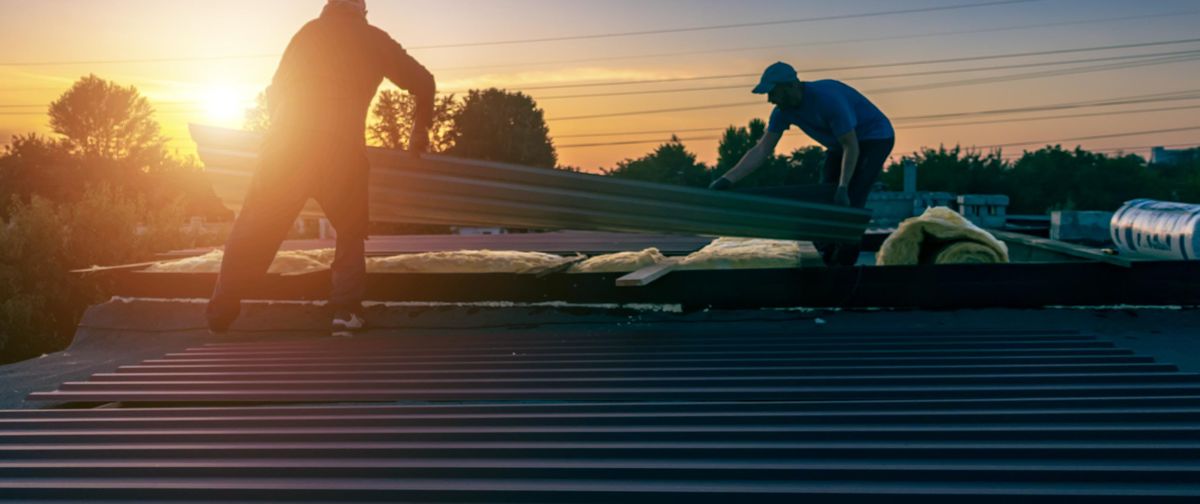 two people working on a roof
