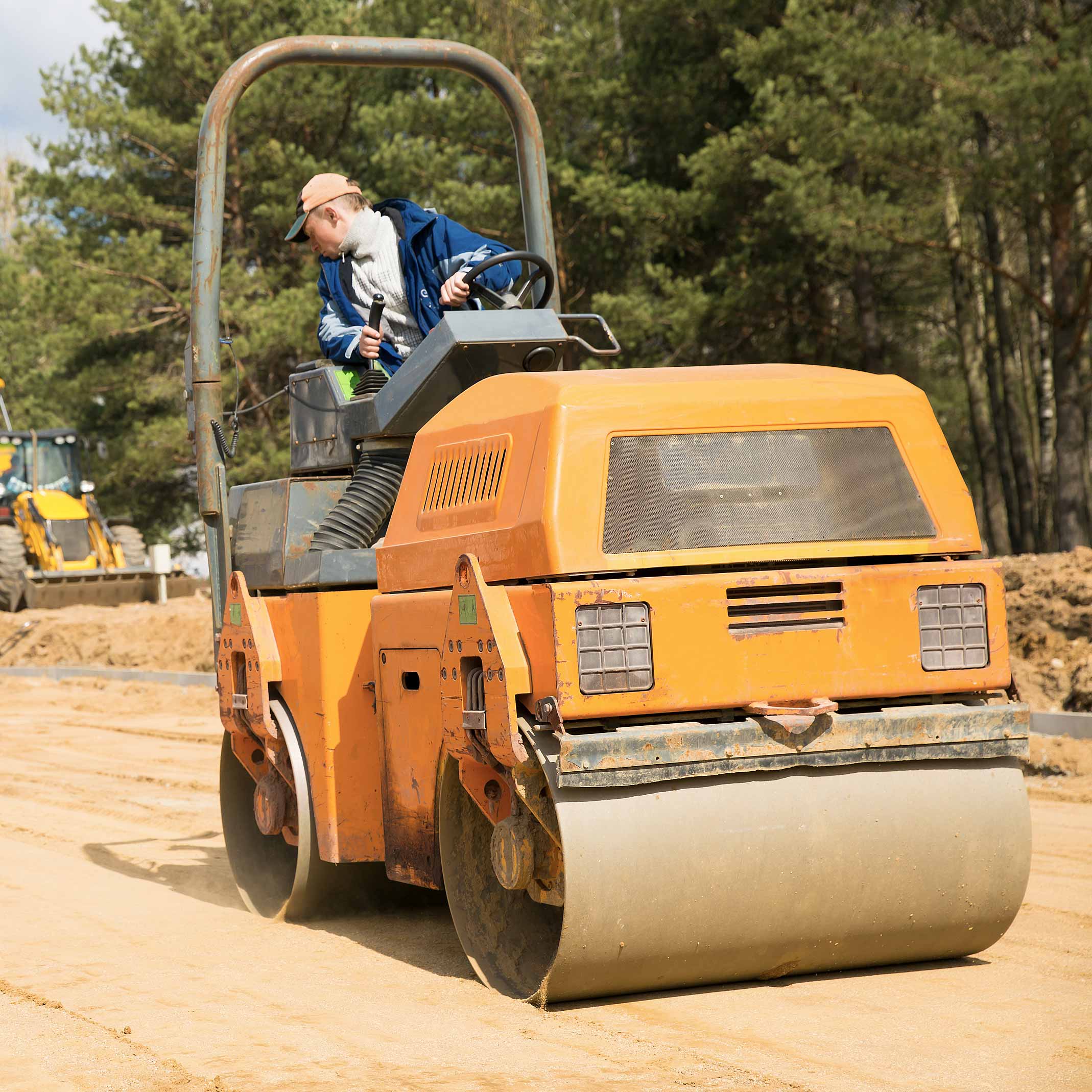 person on a steam roller